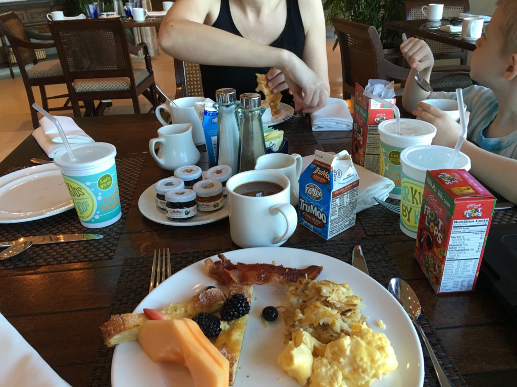 a group of people eating breakfast at a restaurant