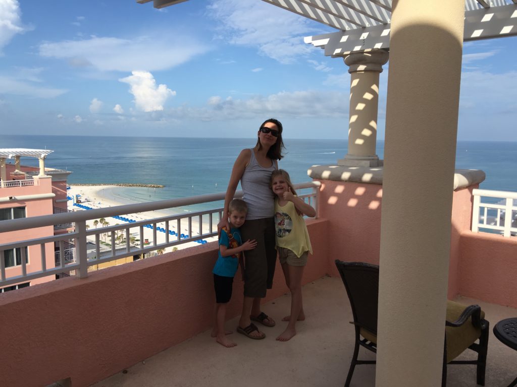 a woman and two children posing for a picture