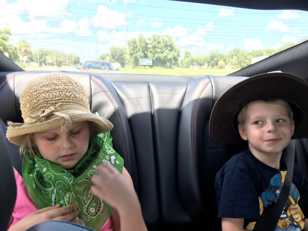a group of kids in a car