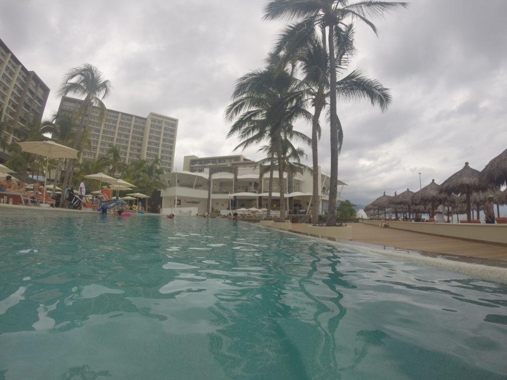 The infinity pool with swim-up bar