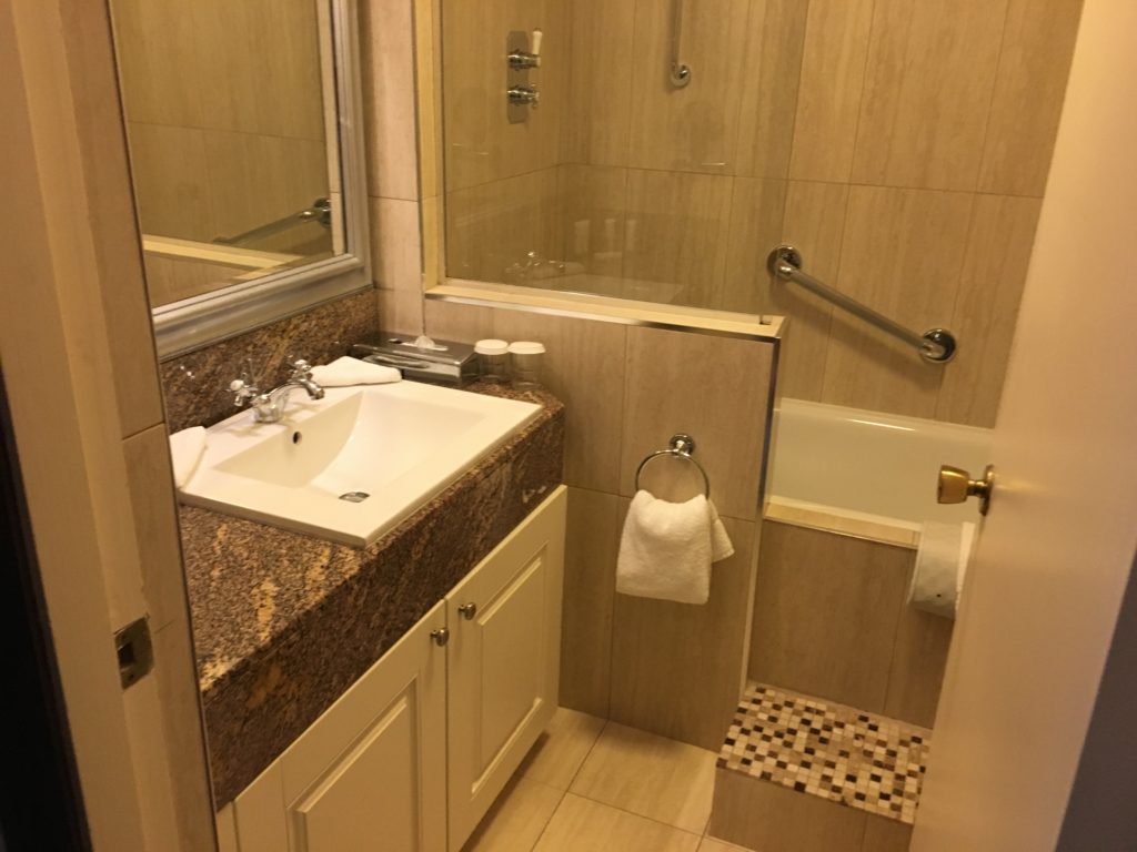 a bathroom with a sink and shower