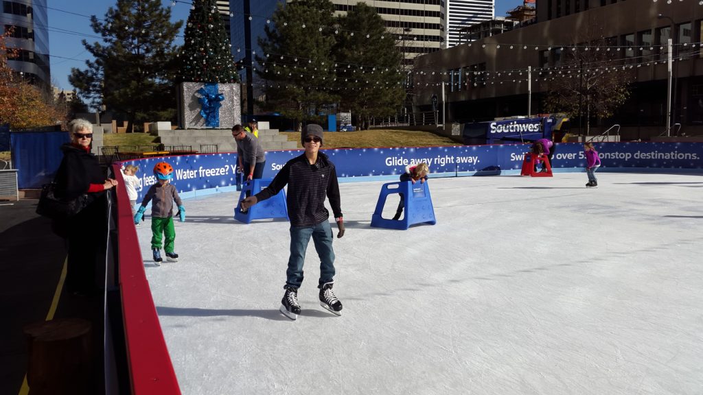 a man ice skating on a rink