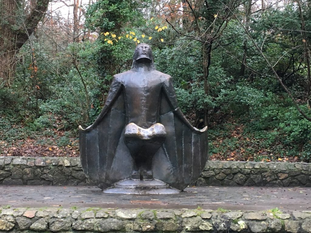 a statue of a man in a cloak