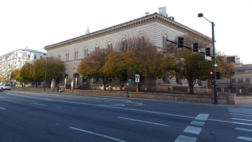 a building with trees on the side of it