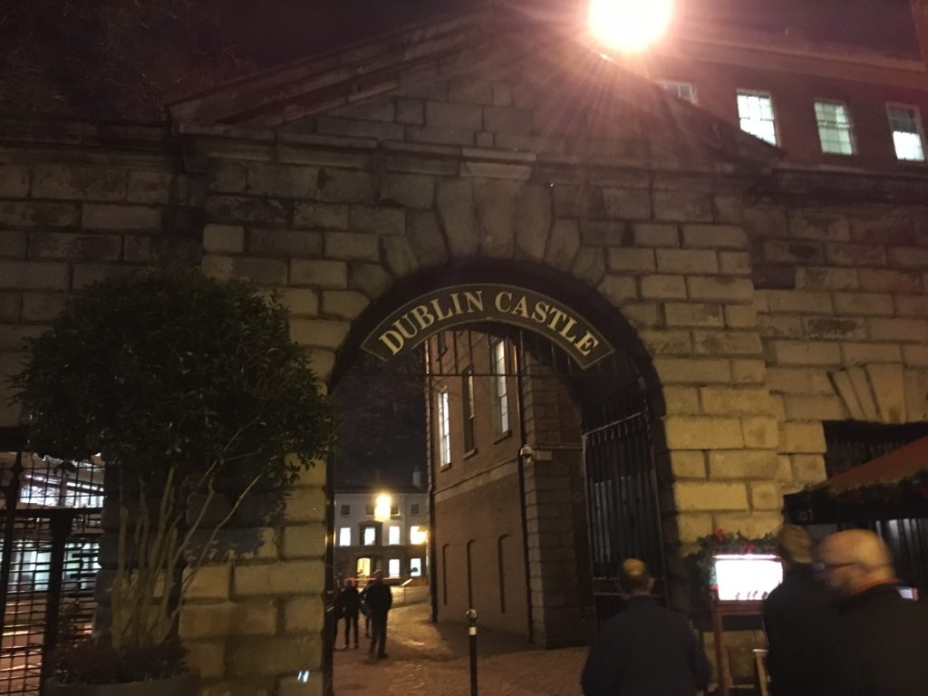 a stone archway with a sign on it