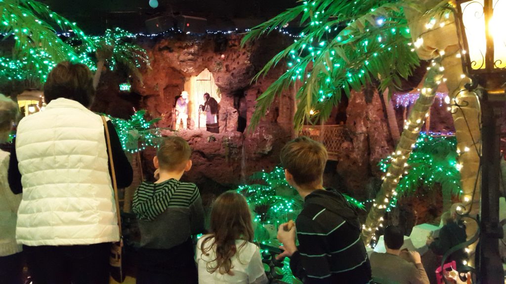 a group of people looking at a stage with lights