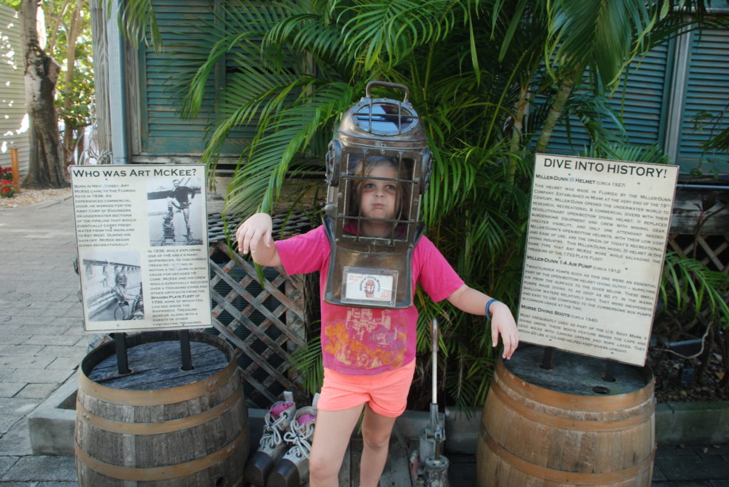 a girl wearing a diving helmet