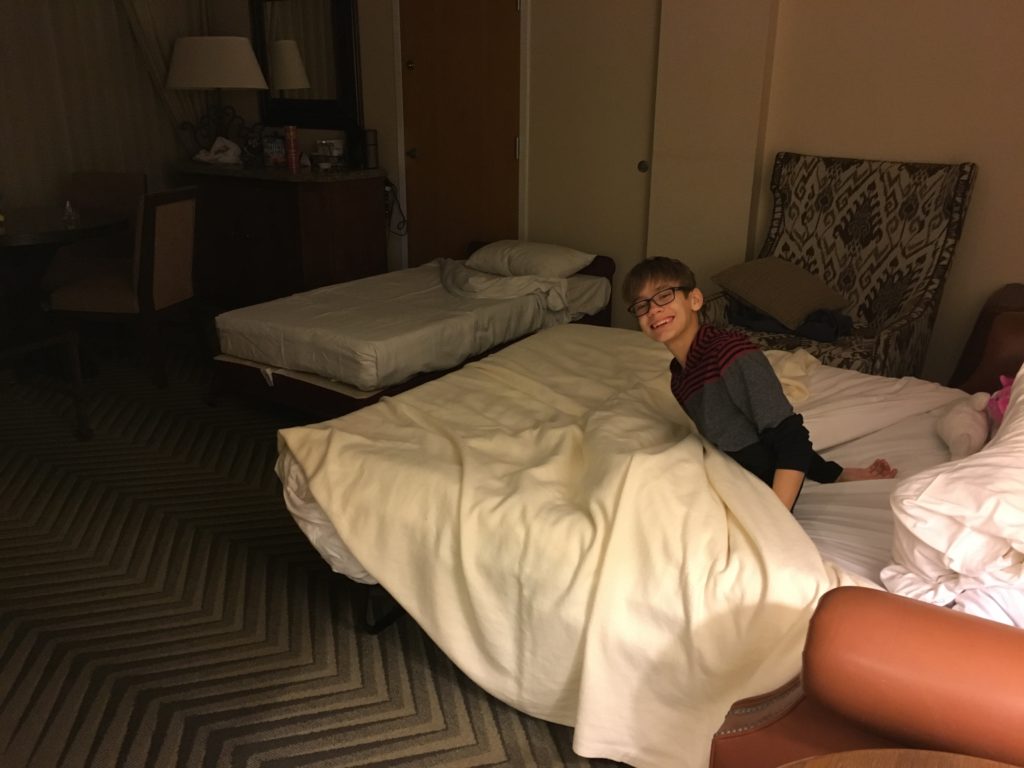 a boy lying on a bed