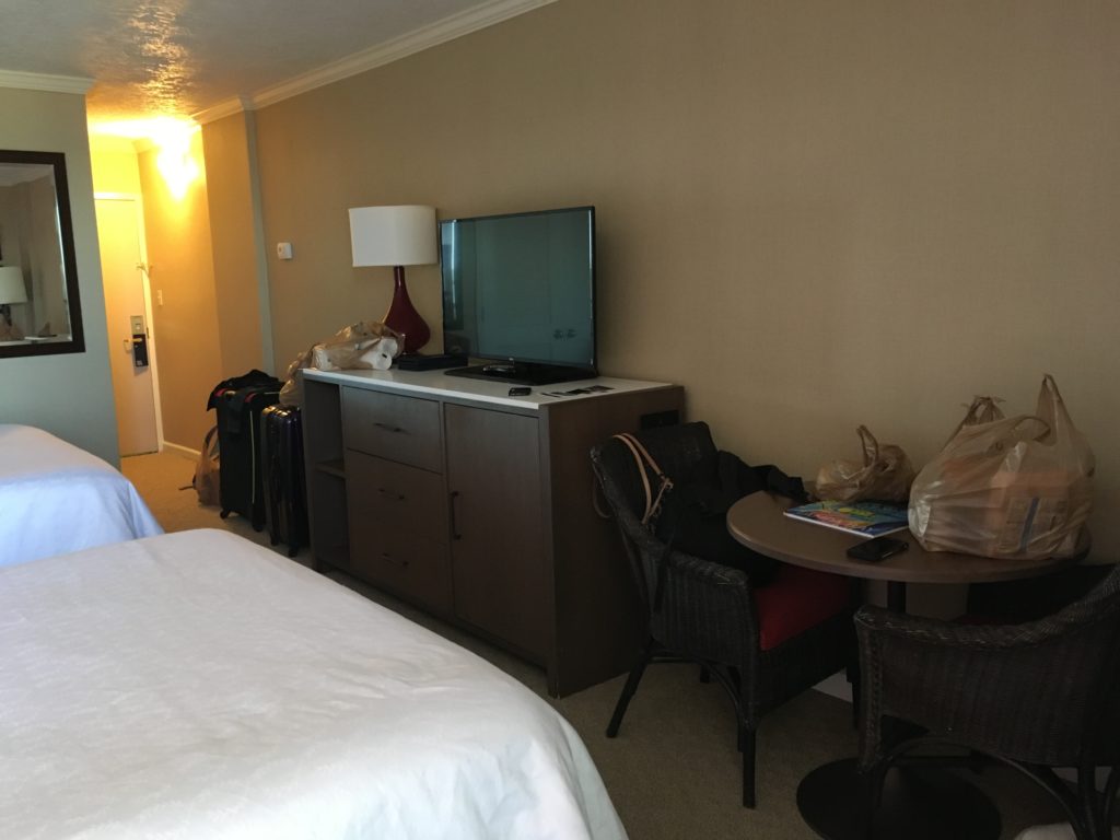 a room with a television and a table