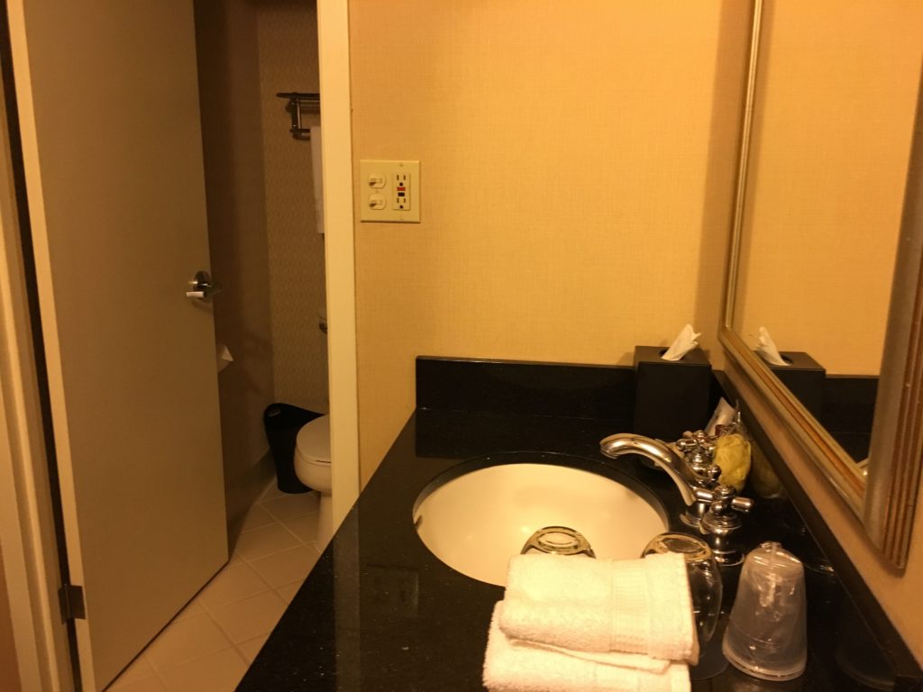 a bathroom with a sink and towels