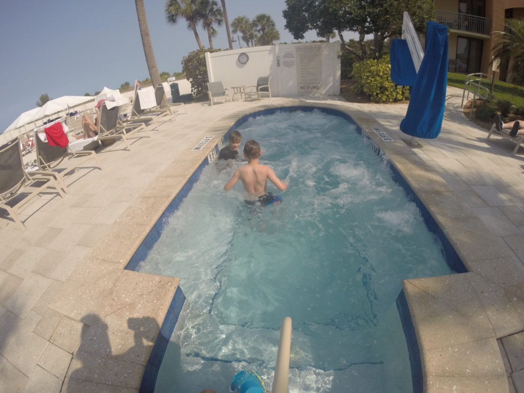 a group of kids in a swimming pool