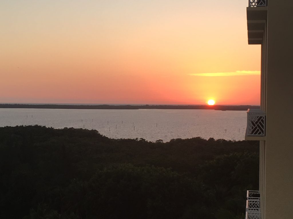 a sunset over a body of water