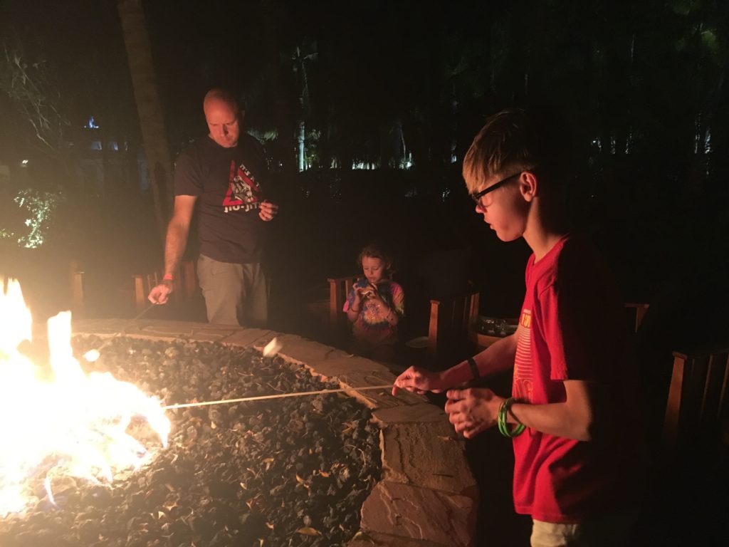 a group of people around a fire