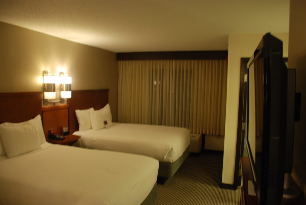 a hotel room with two beds