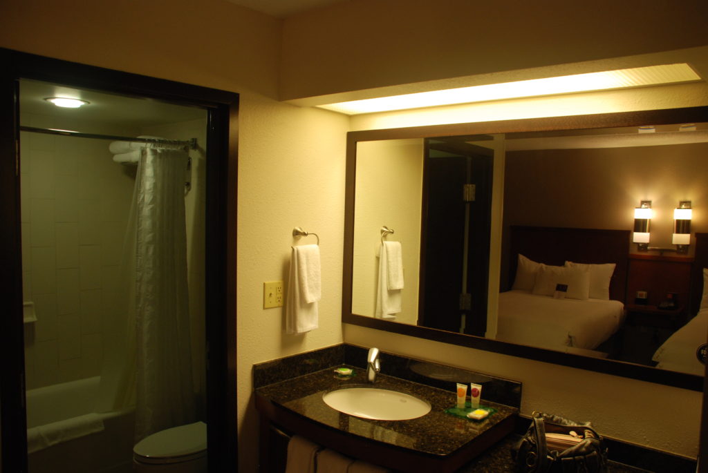 a bathroom with a mirror and a sink