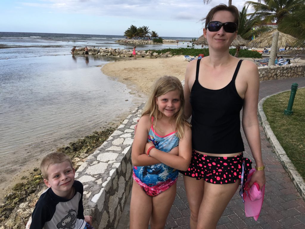 a woman and two children posing for a picture