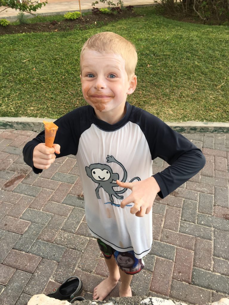a boy with ice cream on his face