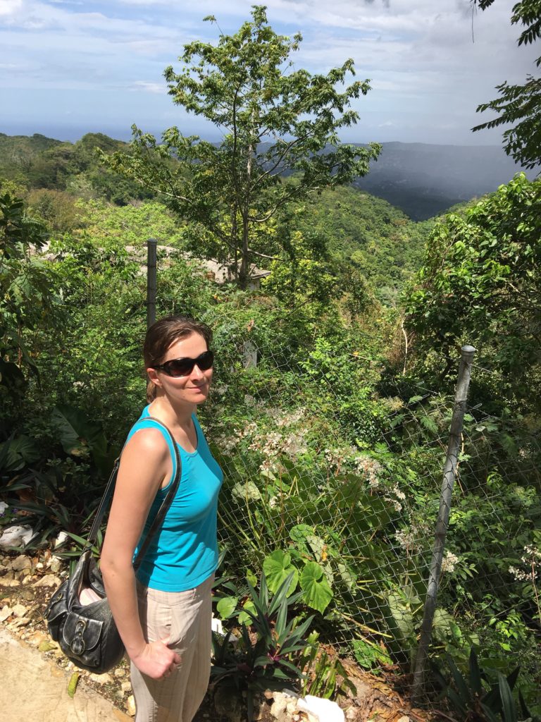 a woman standing in a forest