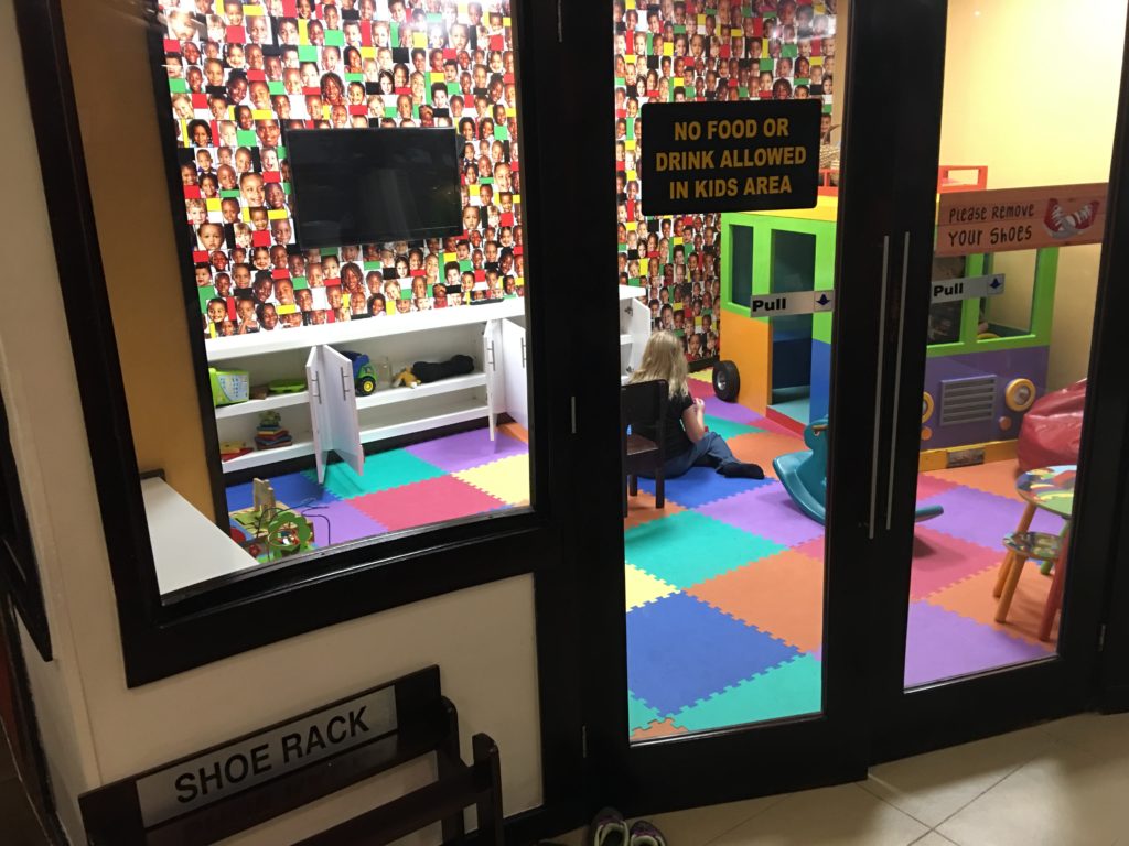 a child sitting in a playroom