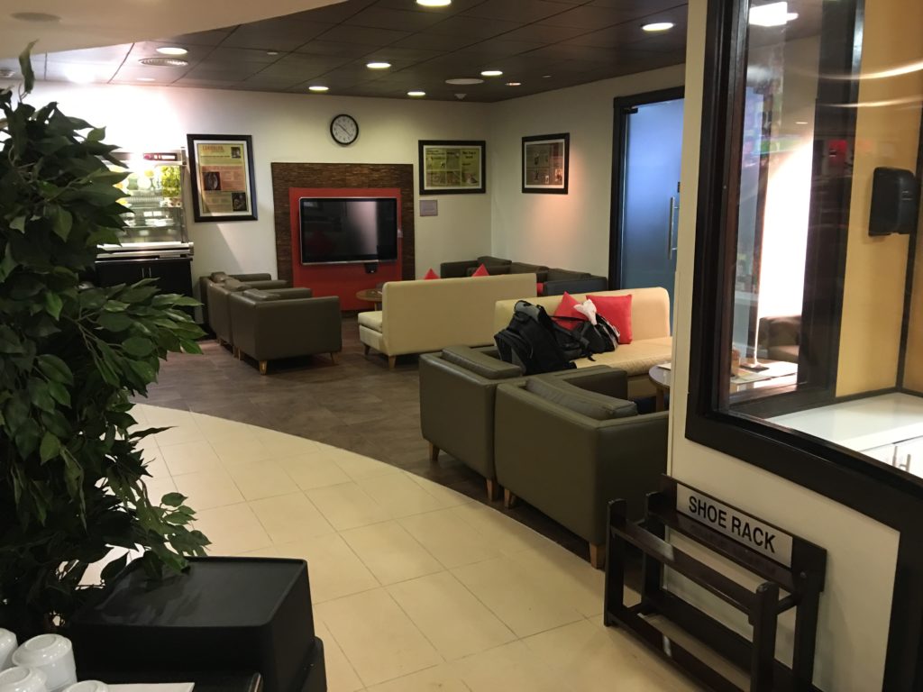 a room with couches and a tv