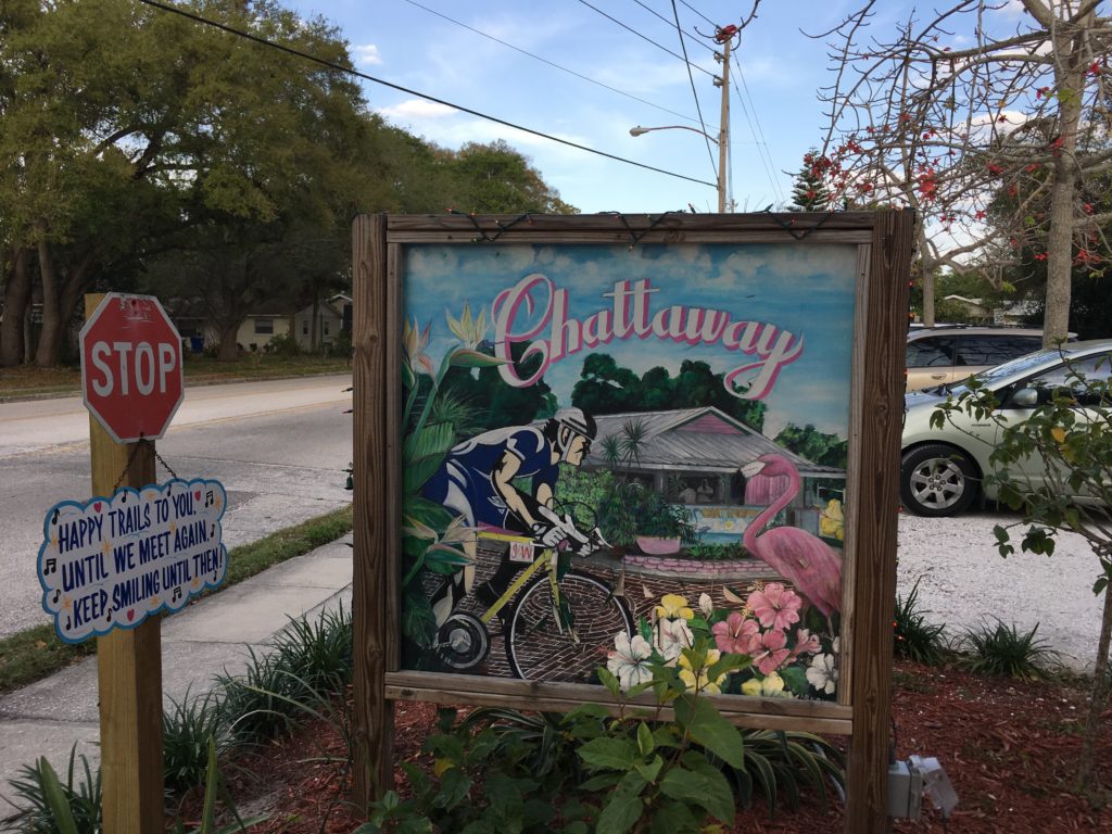 a sign with a picture of a man on a bicycle