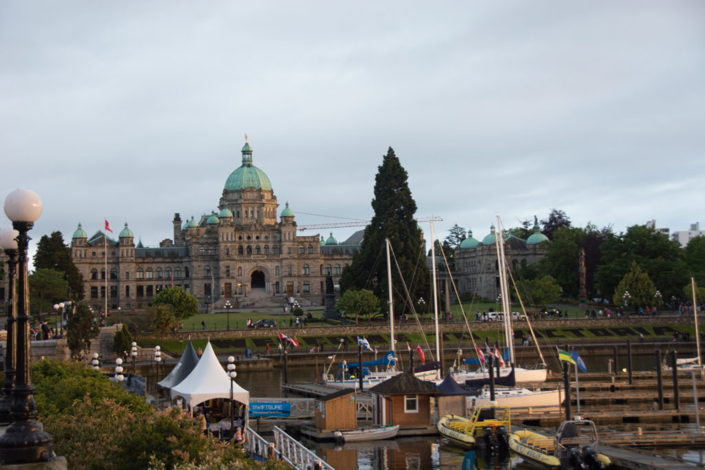 a large building with many boats in front of it