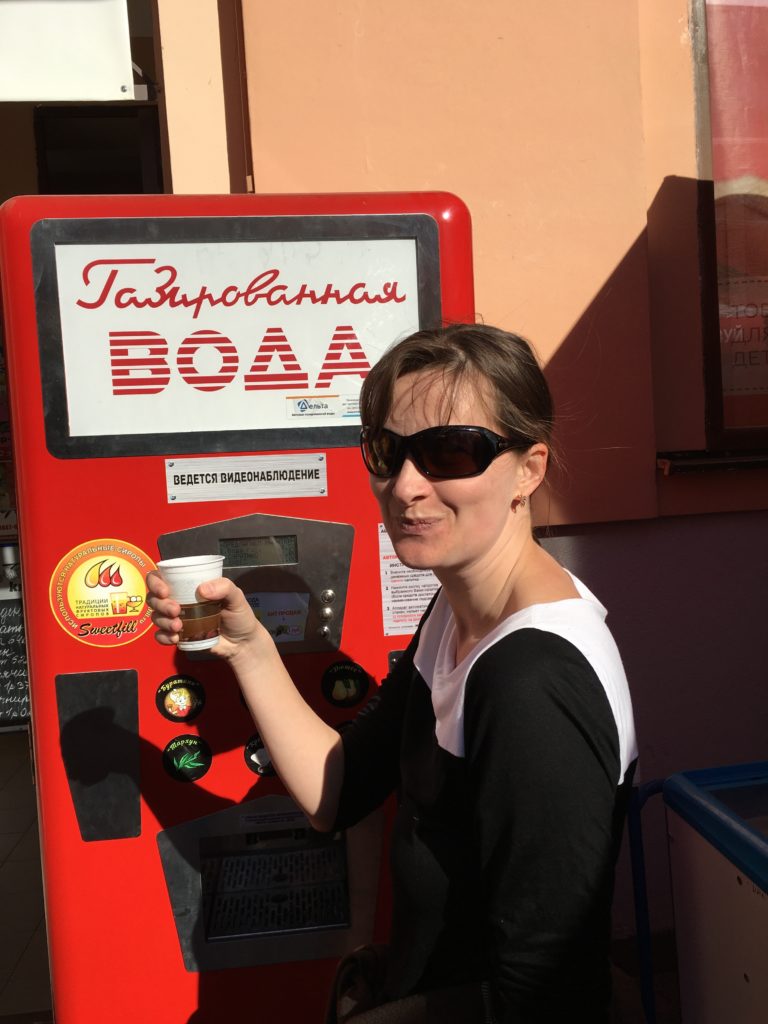 a woman holding a cup of coffee