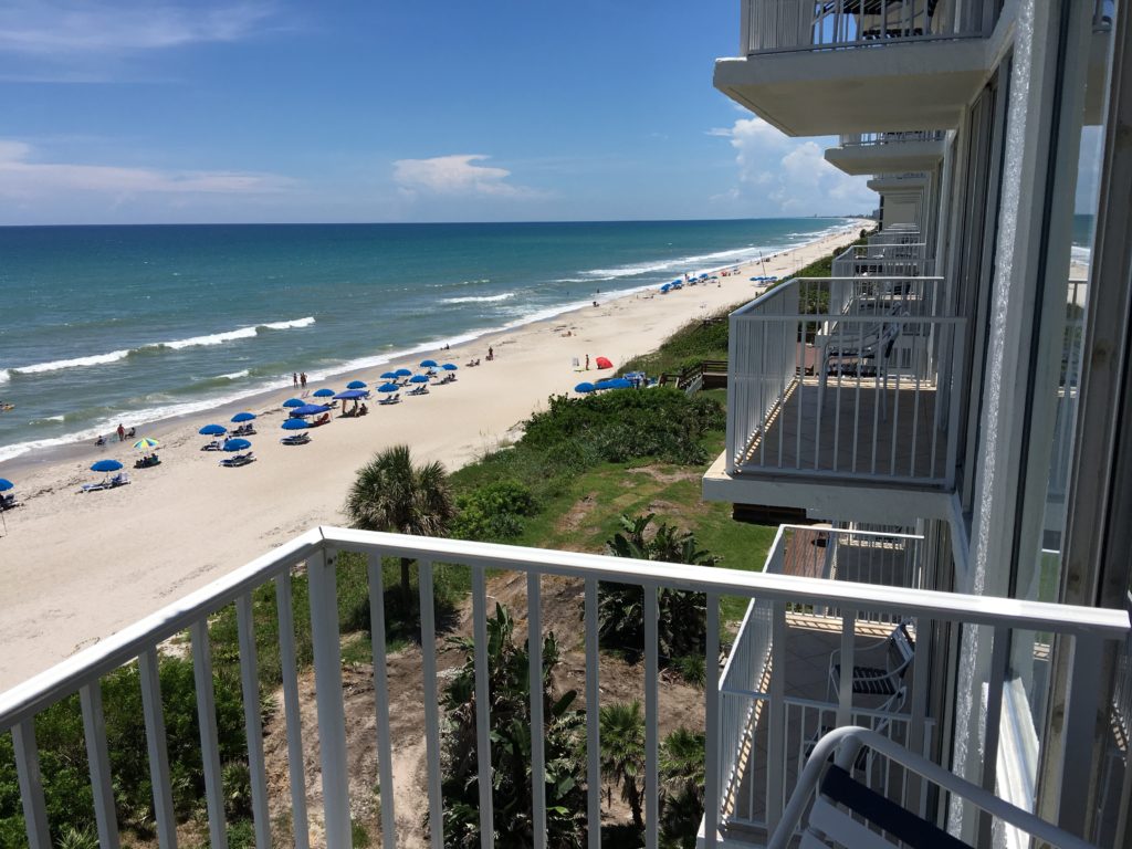 a balcony overlooking a beach