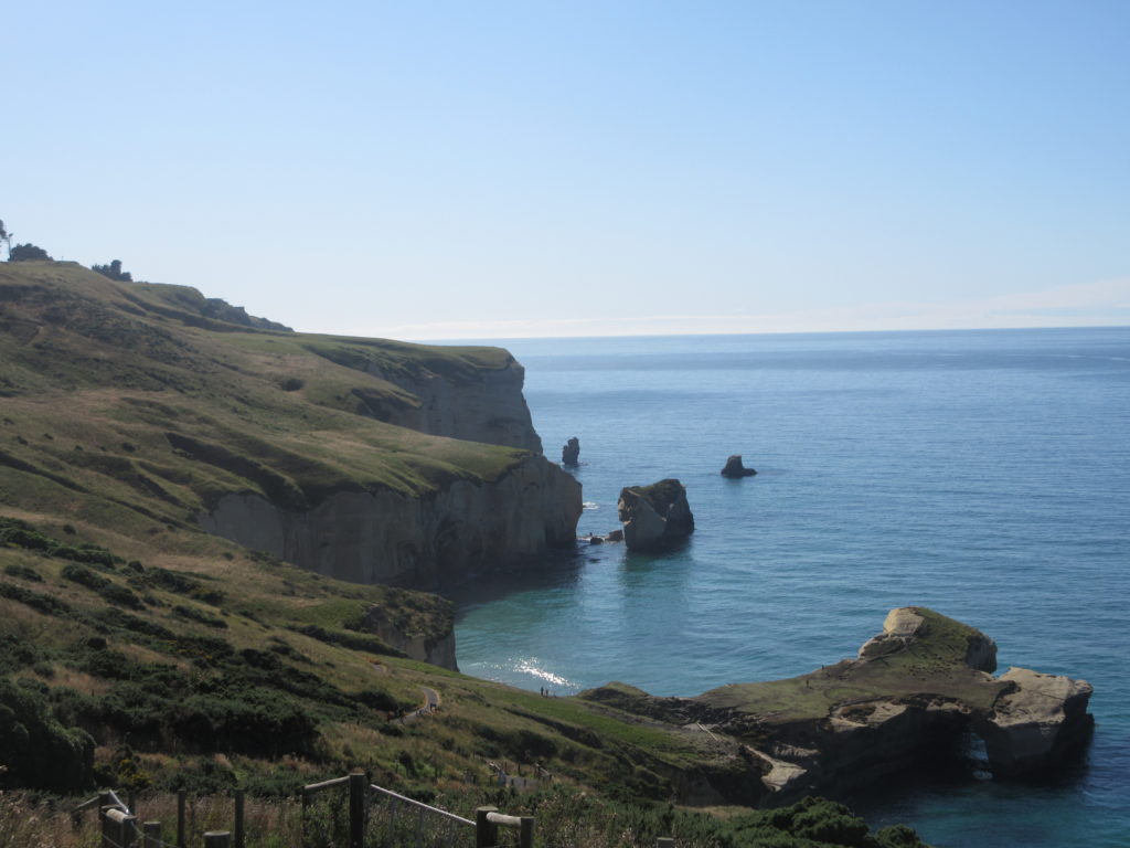 a cliff next to the water
