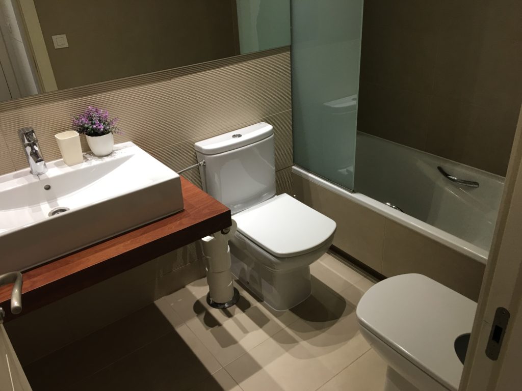 a bathroom with a sink and toilet
