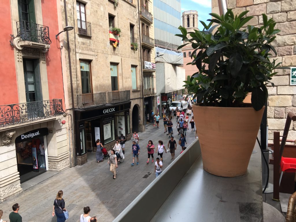 a group of people walking on a street