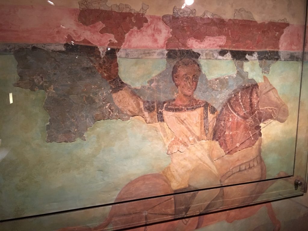 a painting of a man on a horse