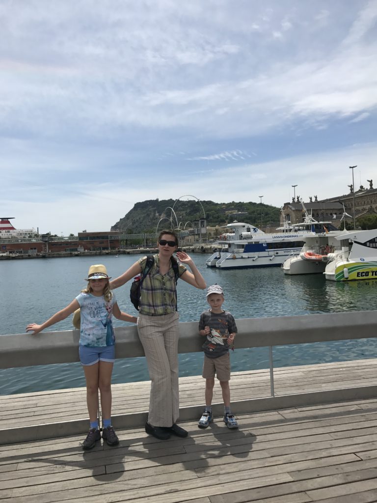 a woman and two children posing for a picture