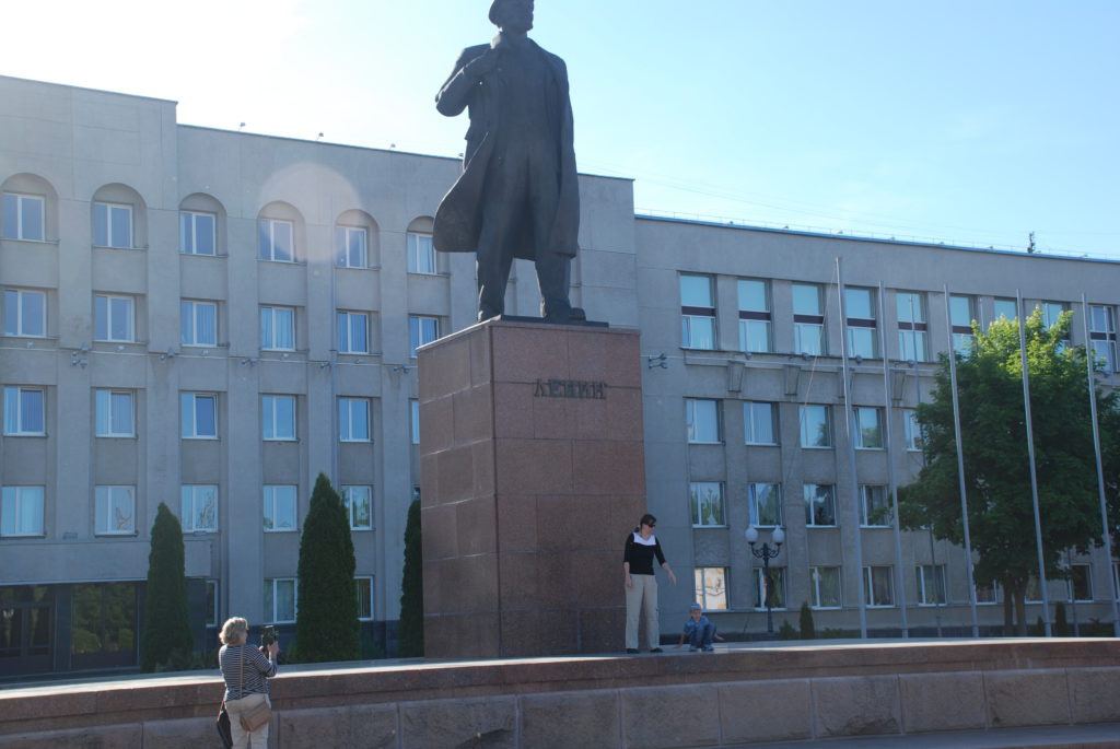 a statue of a man in front of a building