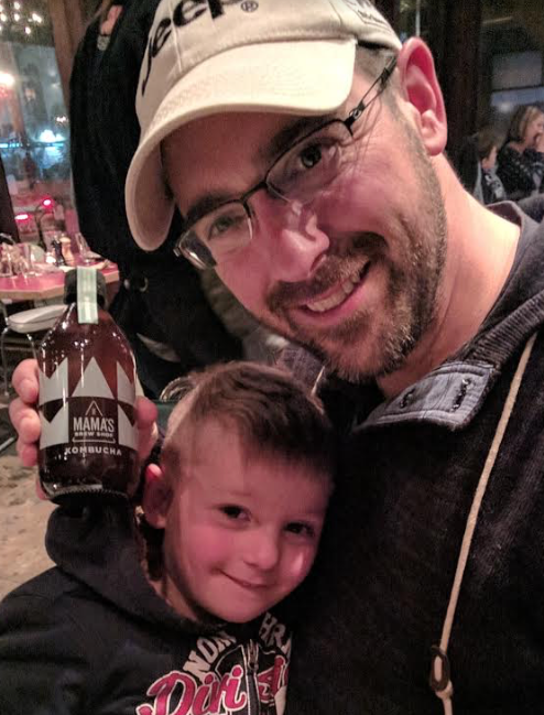 a man holding a bottle of alcohol