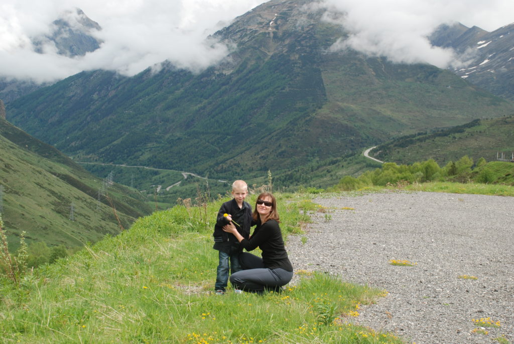 a woman and a boy posing for a picture