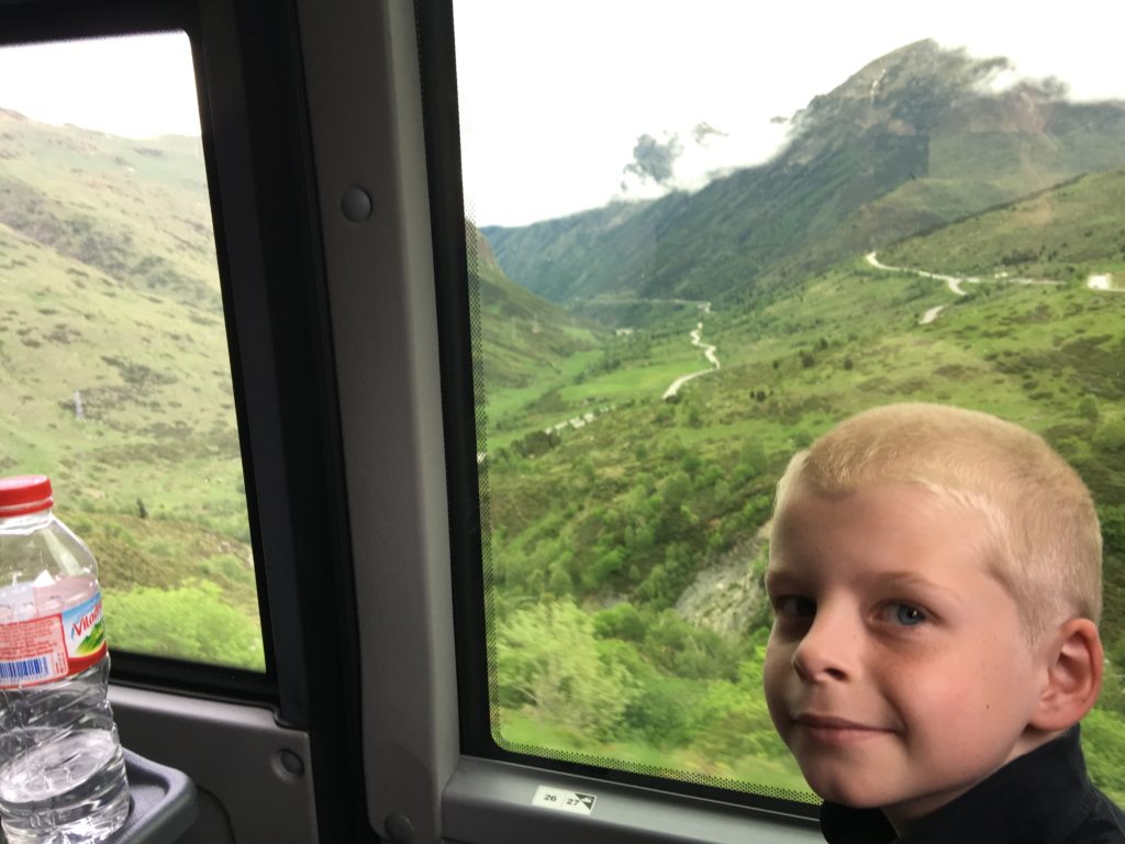 a boy looking out a window