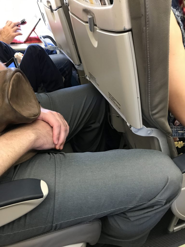 a person sleeping on an airplane
