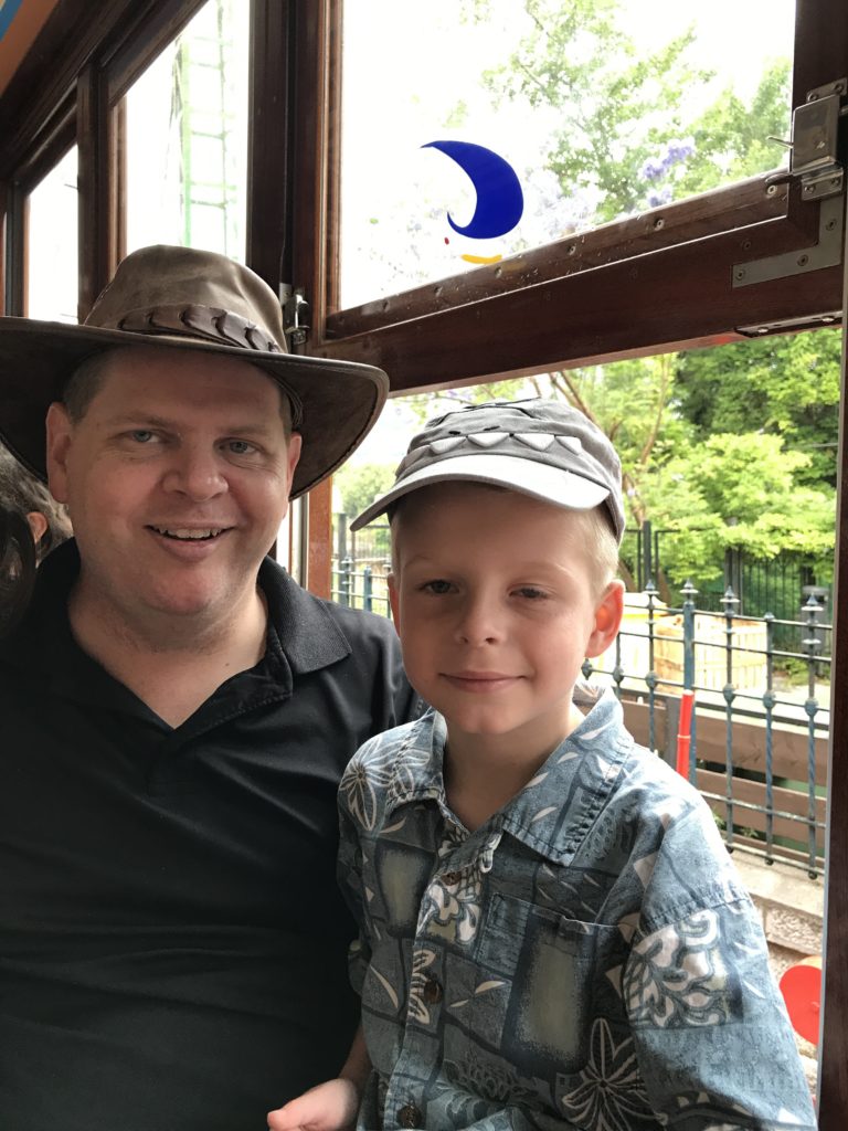 a man and boy posing for a picture