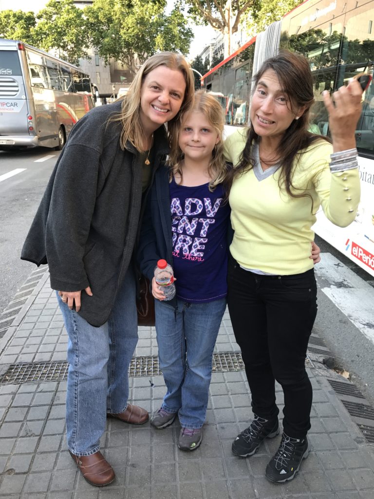 a group of women and a girl posing for a picture