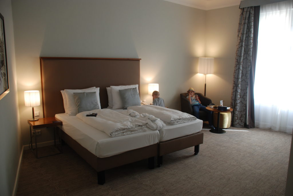 a couple of people sitting in a hotel room