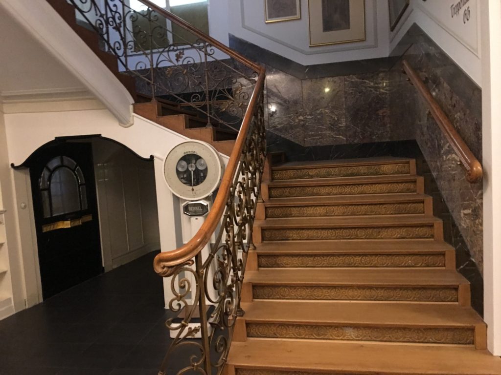 a staircase with a marble railing
