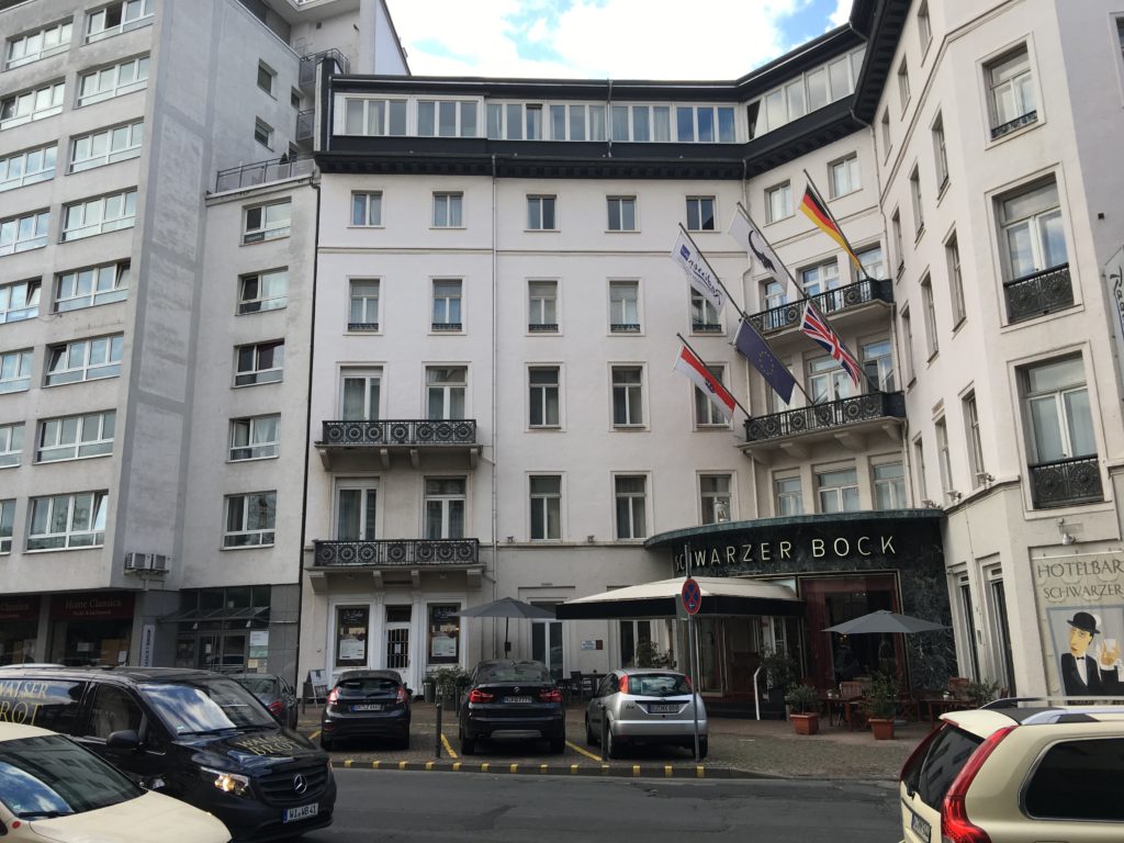 a building with flags on the front