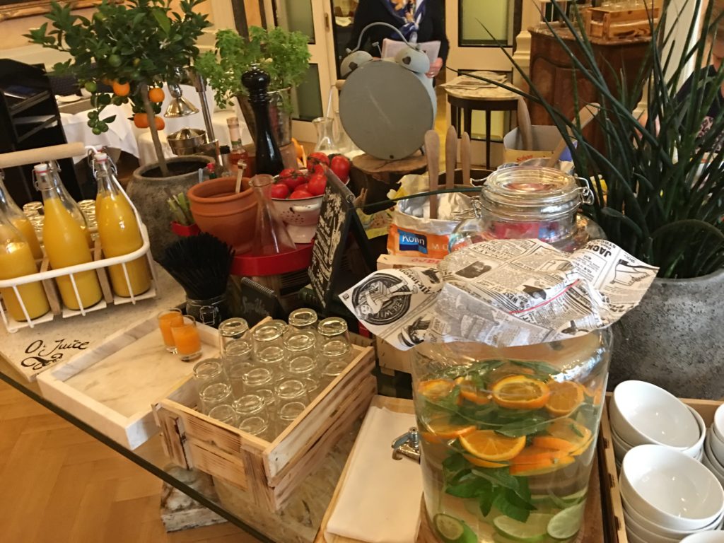 a table with a variety of objects and fruits