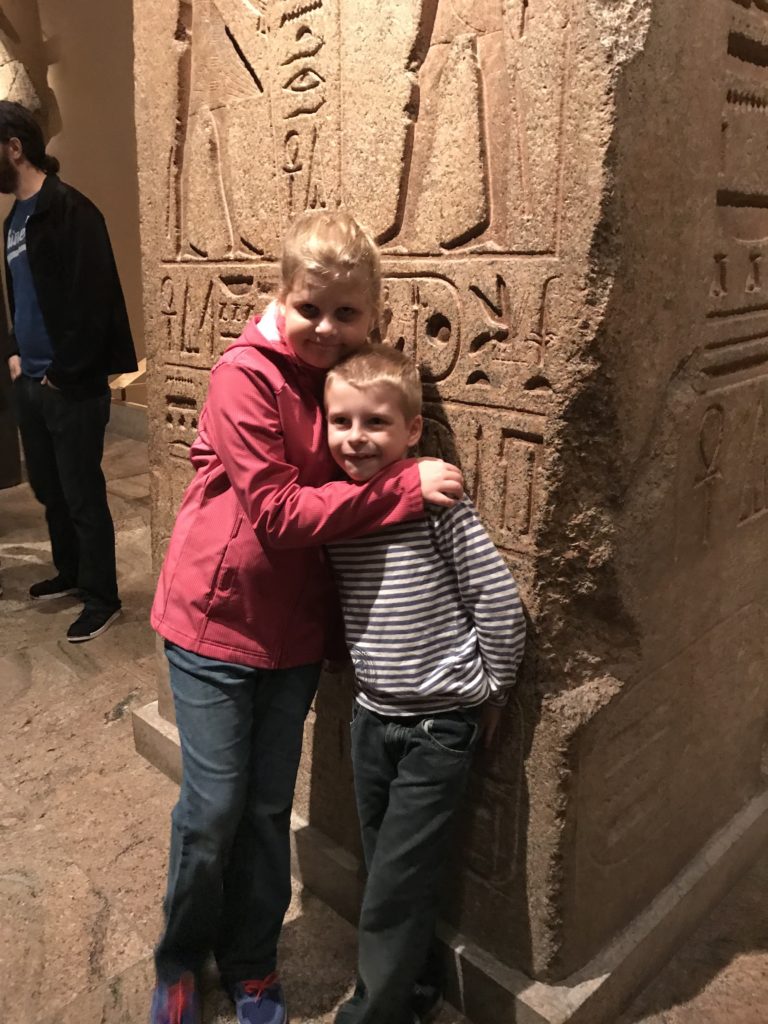 a boy and girl hugging each other