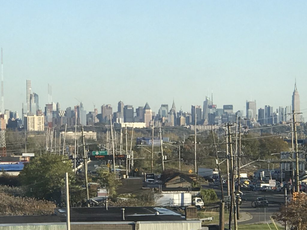 a city skyline with power lines and buildings