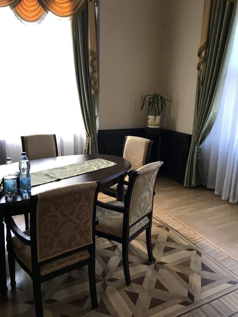 a dining room with a table and chairs