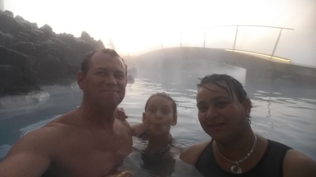 a group of people in a hot spring