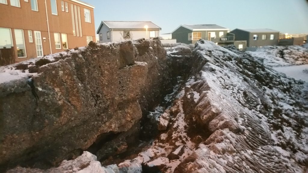 a large rock with snow on it