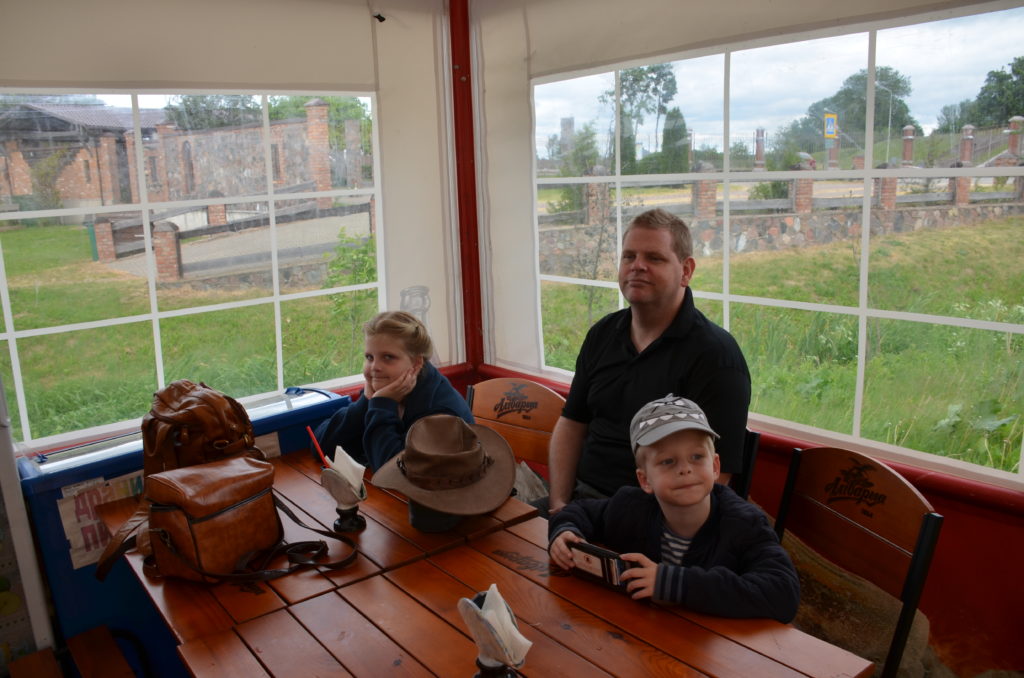 a man and two children sitting at a table